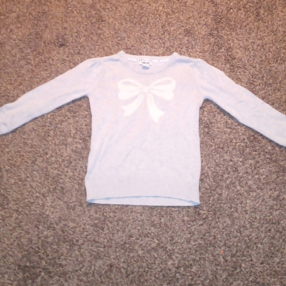 A gray and white Christmas sweater
